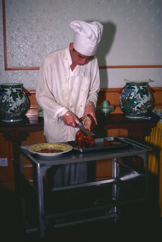 Preparing a Beijing Duck.