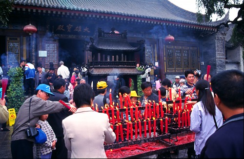 Lighting a Candle at the Temple.